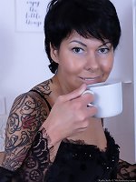 Karla Kole enjoys a hot beverage and naked time